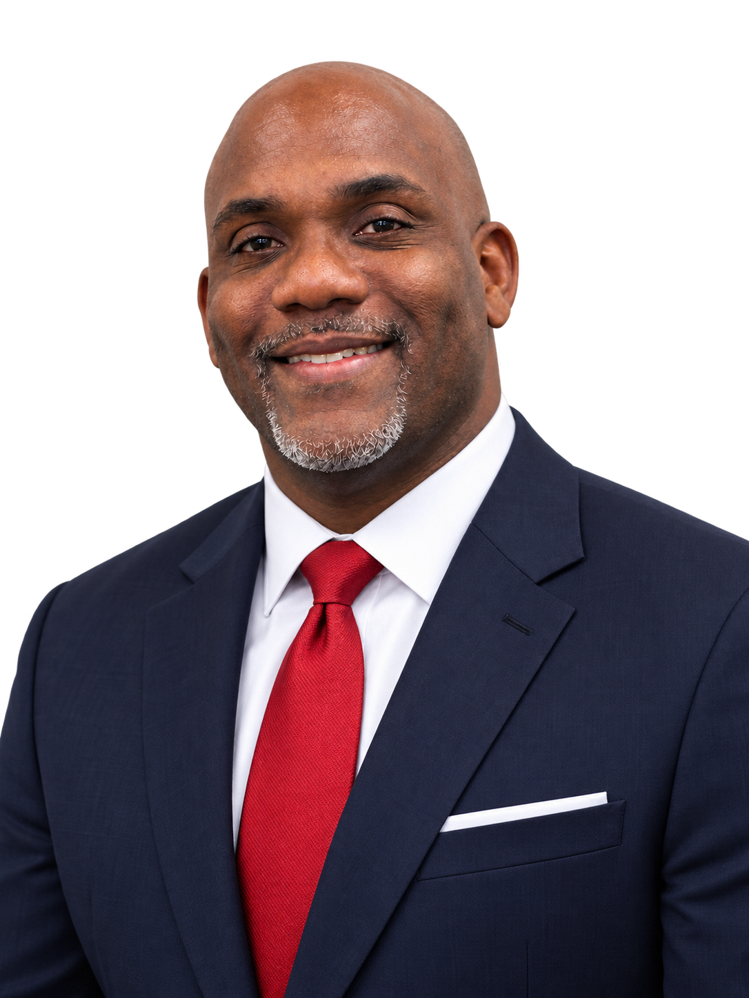 Portrait of Jermaine Fletcher in a navy suit and red tie